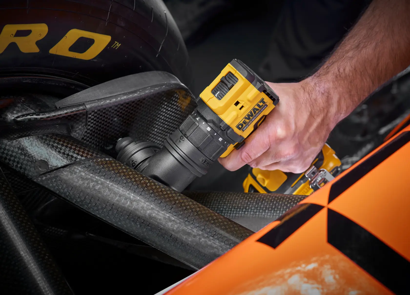 DEWALT drill DCD803D2T-QW, DCD803D2T used on car part. Photography product shown in action.