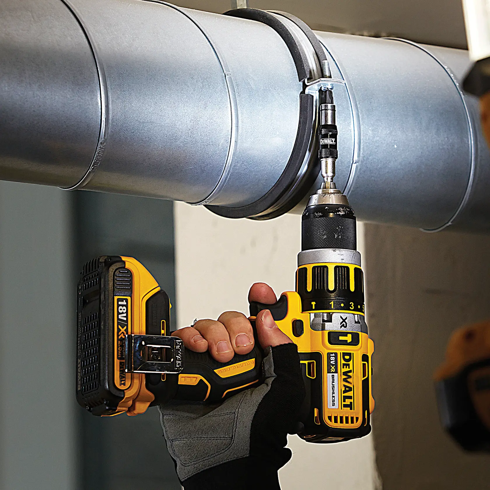 DEWALT DT70578T, DT70578T-QZ drill bit in use on metal duct, photography product.